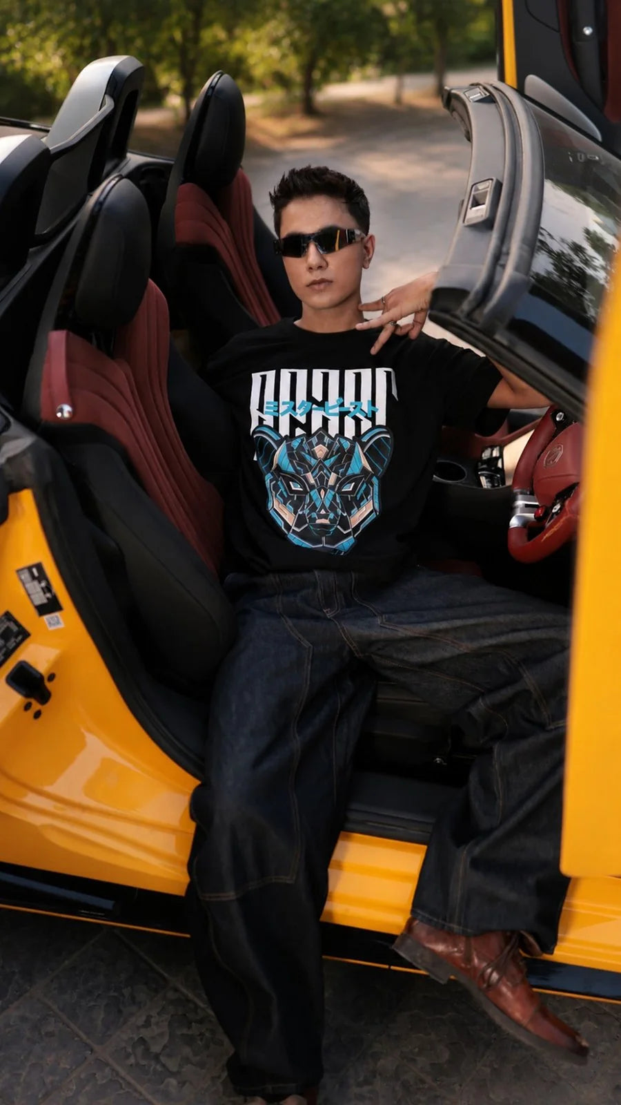 MrBeast Cyber Panther tee worn in a yellow convertible